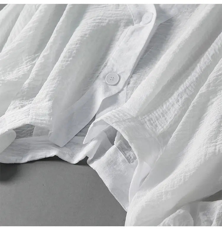 Stylish women's flowy batwing summer top with button detail, a comfortable and chic loose-fit blouse.