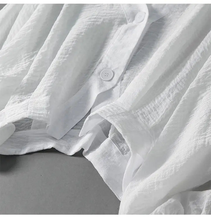 Stylish women's flowy batwing summer top with button detail, a comfortable and chic loose-fit blouse.