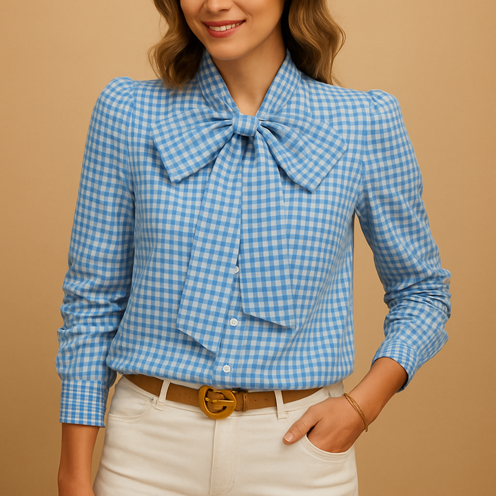 Stylish gray plaid women's blouse with delicate bow neck detail. Versatile and elegant for office or everyday.