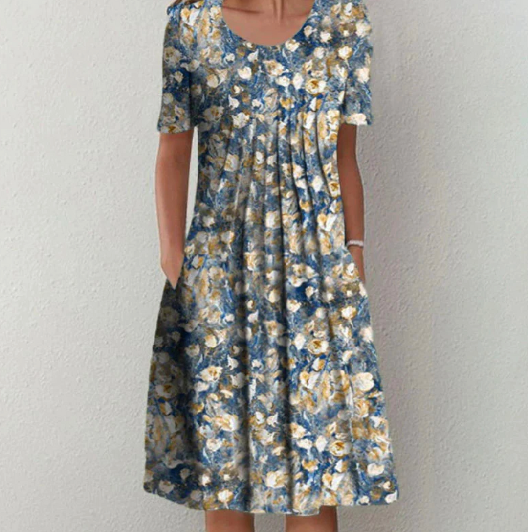 Vibrant printed A-line pleated midi summer dress for women, a comfortable and chic flowy design for any occasion.