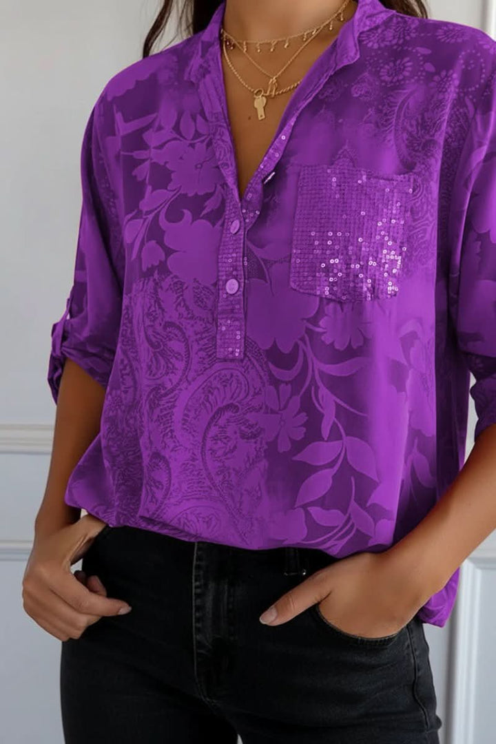Women's elegant long sleeve printed blouse, featuring a stylish pattern and a handy front pocket design.
