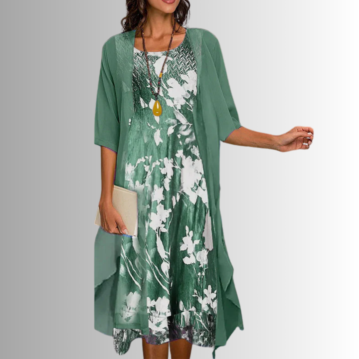 Chic women's printed layered midi dress with open front, uneven hem & 3/4 sleeves. Versatile for smart casual.