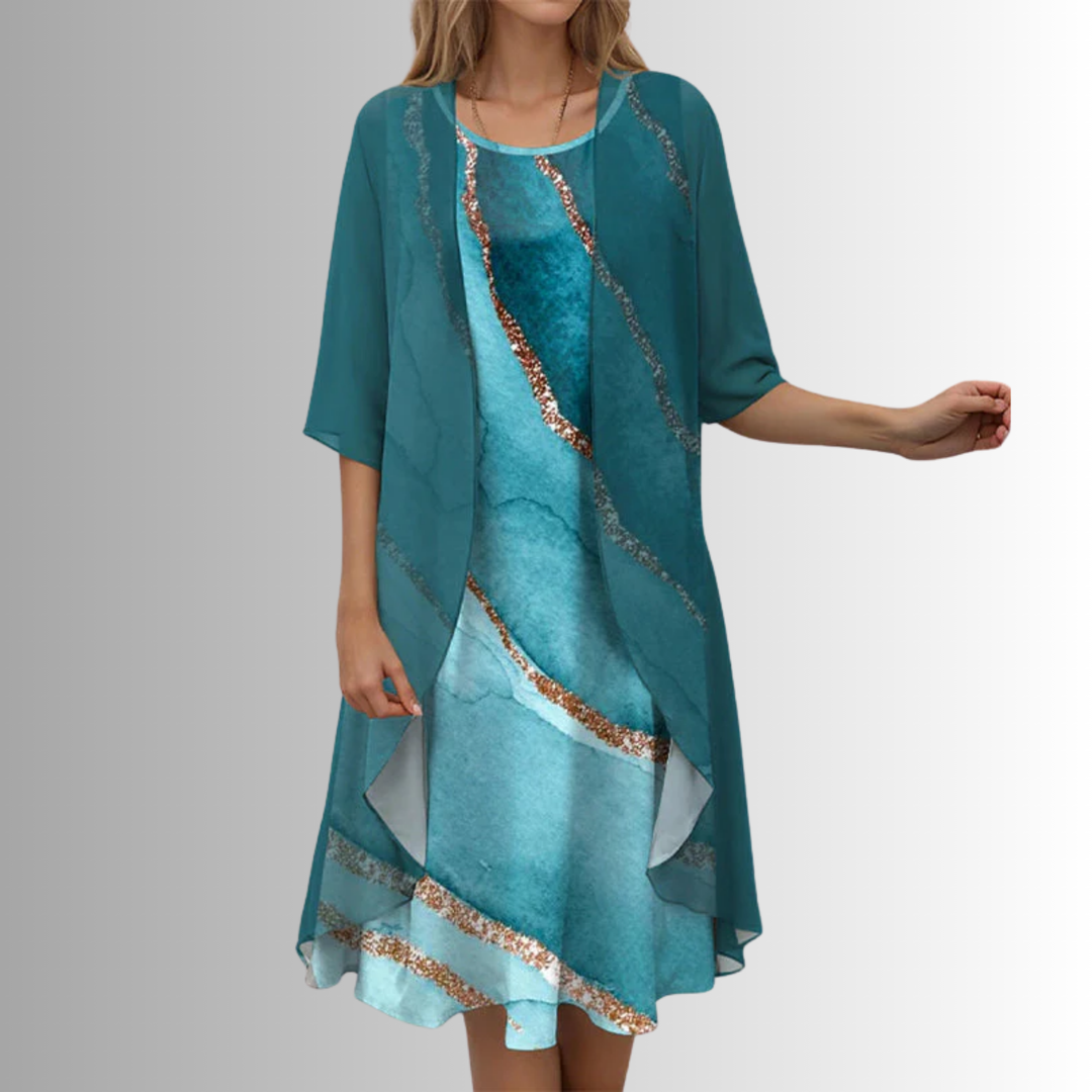 Women's vibrant printed midi dress featuring an open-front and stylish layered design with an uneven hemline.
