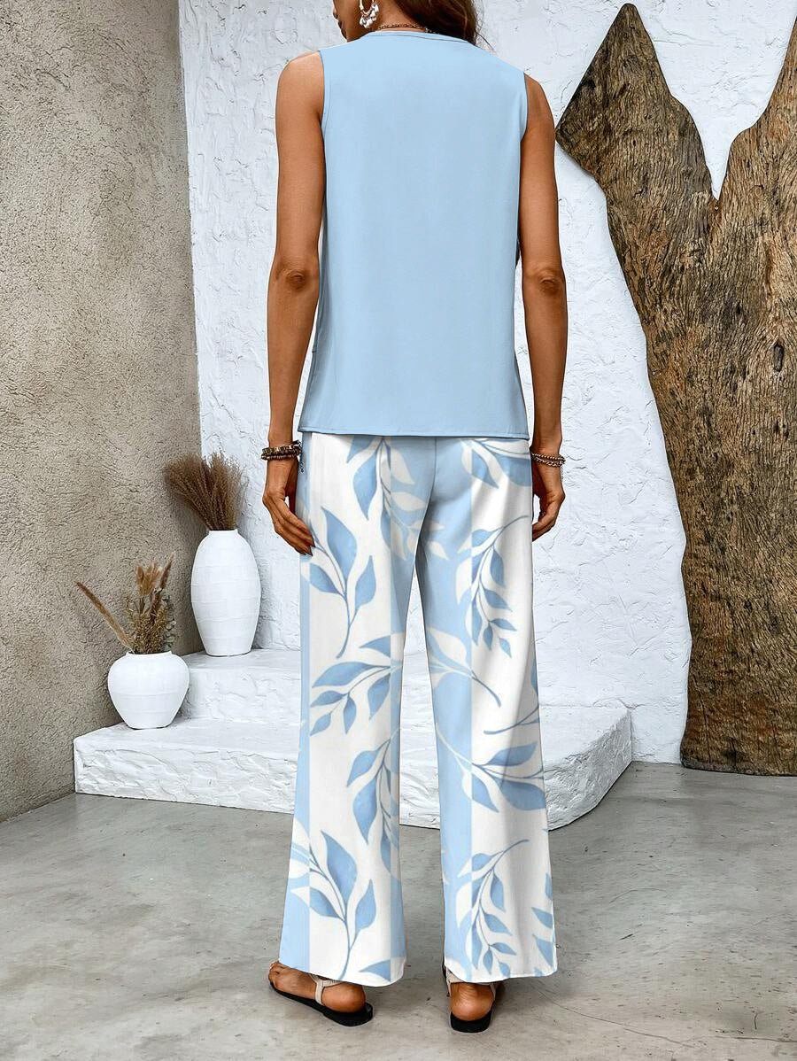 Women's fashion set: elegant flowy top with wide-leg pants. Ideal two-piece summer outfit for ladies.