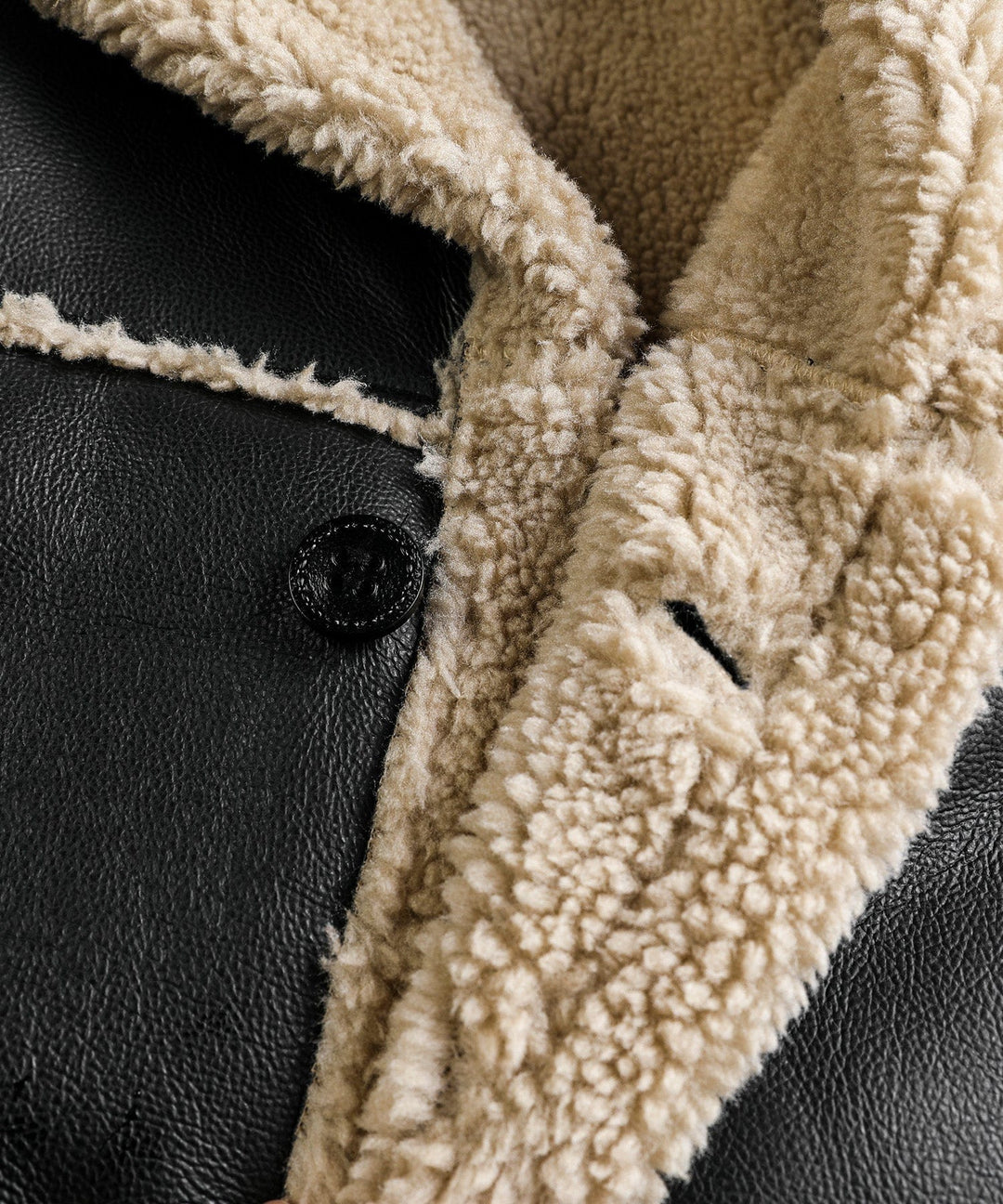 Classic black aviator coat, unisex, showcasing luxurious faux shearling insulation and style.