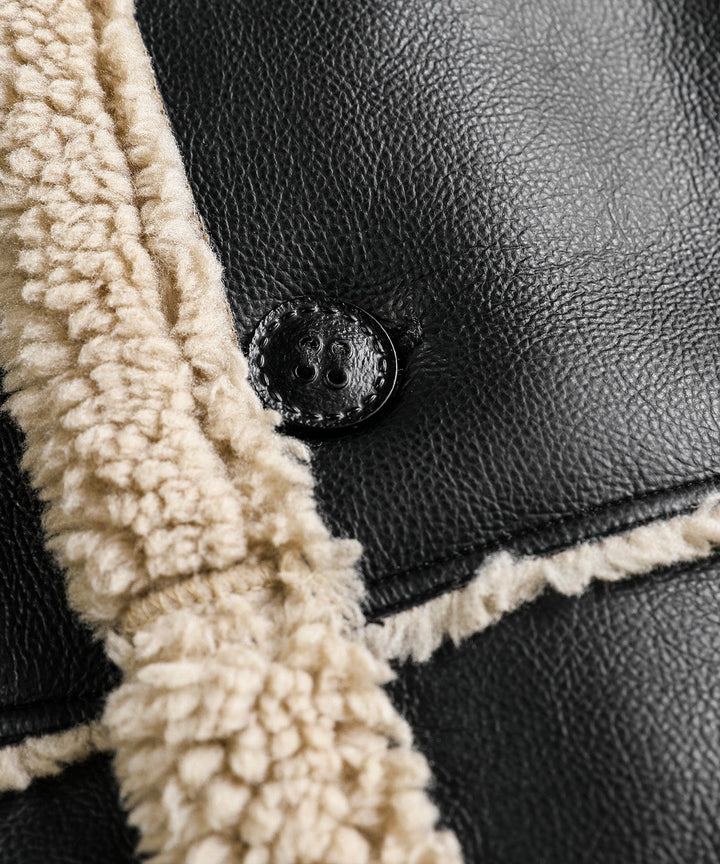 Unisex black aviator jacket, a winter essential with a comfortable faux shearling lining and classic design.