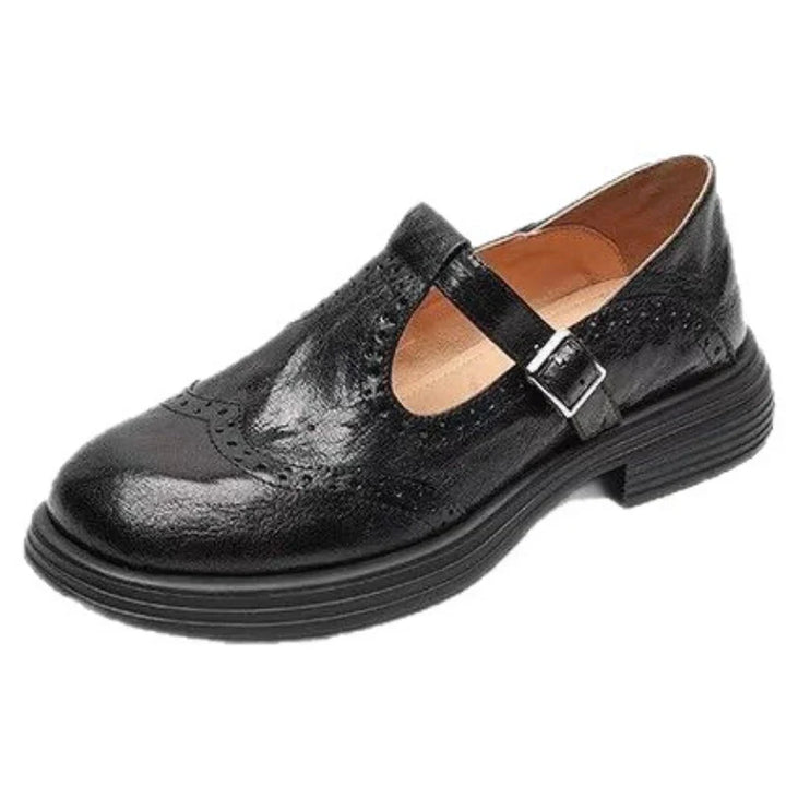Close-up of black leather T-strap Mary Jane shoes, highlighting classic design and quality craftsmanship