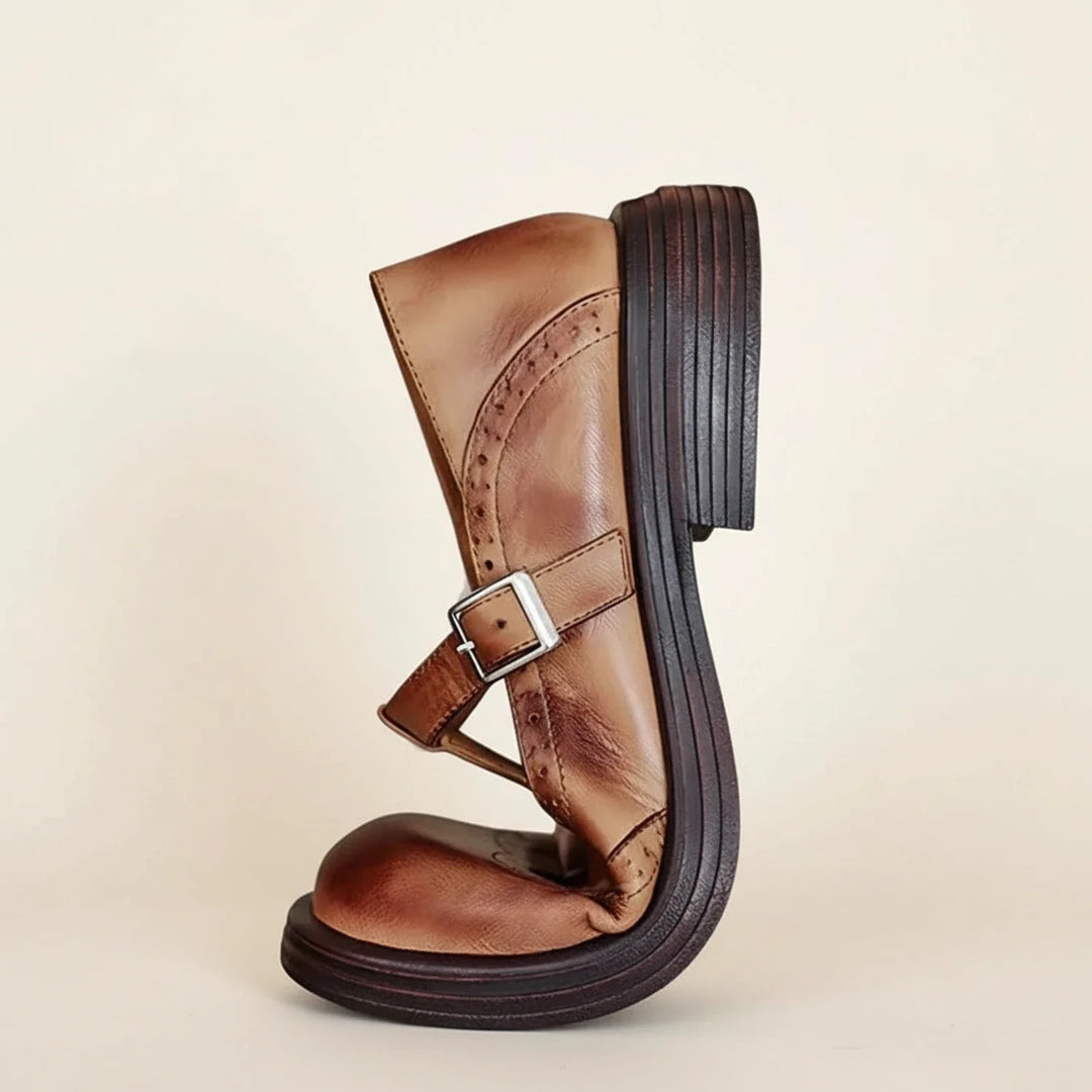 Women's vintage-style black Mary Jane T-strap platform heels featuring a round toe and buckle closure.
