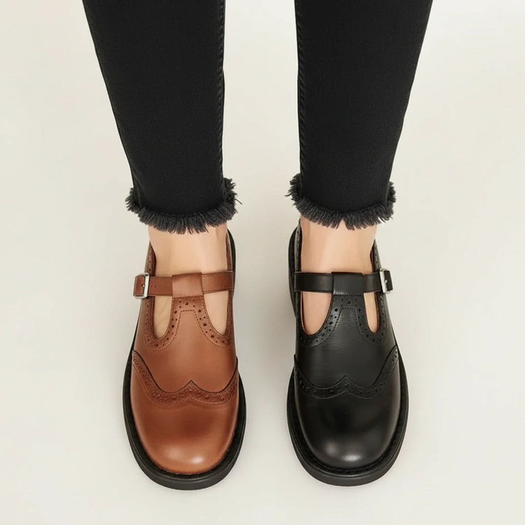 Classic women's Mary Jane T-strap platform heels with round toe, buckle closure, and lug sole in black.
