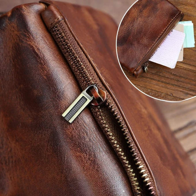 Classic men's full-grain leather wallet, black, presented on a wooden surface.
