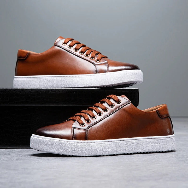 Brown leather low-top sneakers for men, combining classic style with everyday comfort.