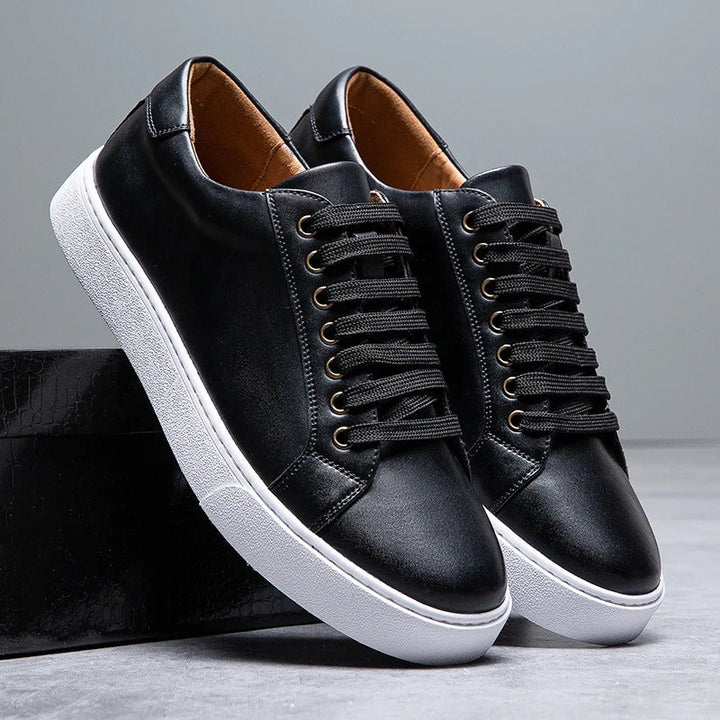 Side view of men's leather low-top sneakers, highlighting the sleek design and comfort.