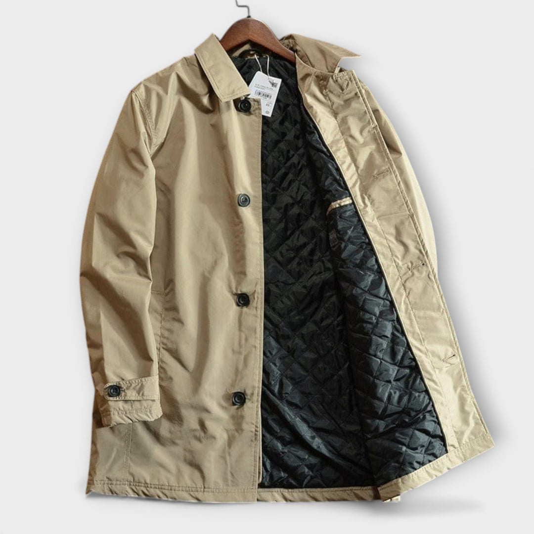 Button Front Men's Coat: Detail shot of a men's classic car coat, highlighting the elegant button-front closure & clean lines.