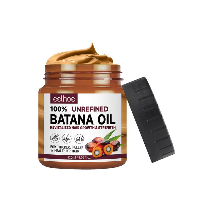 Clear bottle of 100% pure Batana oil for hair and skin care, shown against a plain background, highlighting its rich texture.