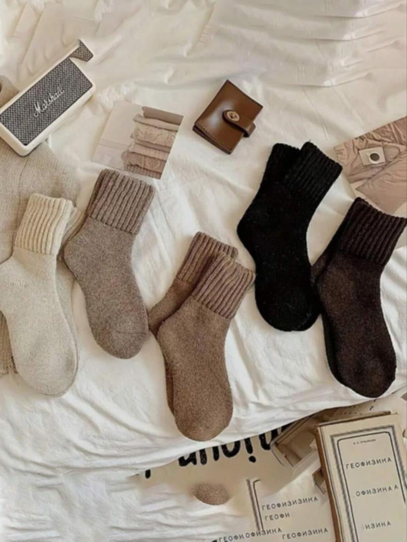 Close-up of women's warm wool blend knit socks in a neutral beige, highlighting cozy texture