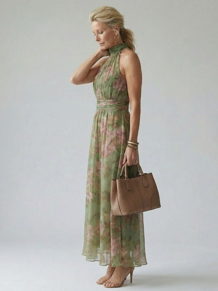 Stylish women's green botanical print halter midi dress. A chic summer sundress, perfect for warm days.