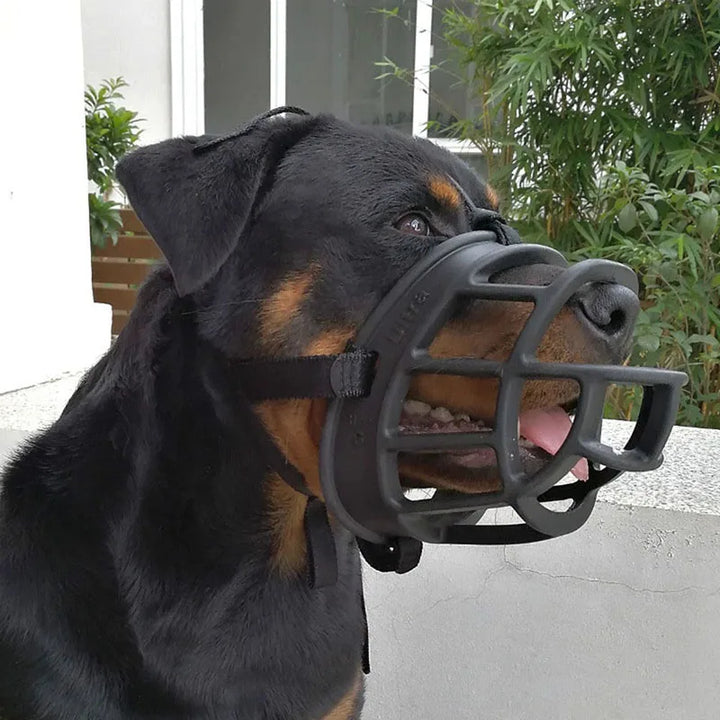 High-quality silicone dog muzzle with adjustable straps for secure & humane fit.