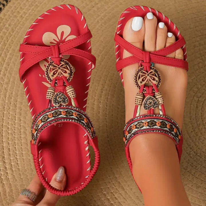 Elegant women's flat T-strap sandals with a stylish design, ideal for warm weather comfort.