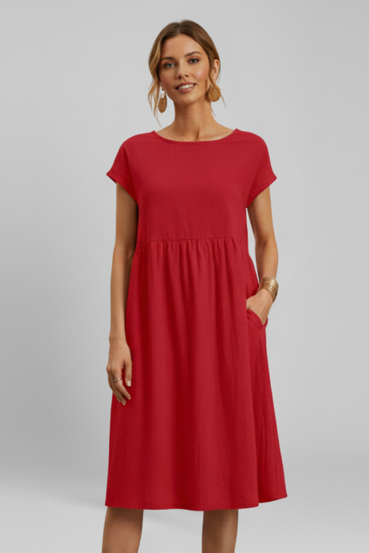 Women's short sleeve knee-length dress, comfortable for everyday wear, with round neck and pockets.