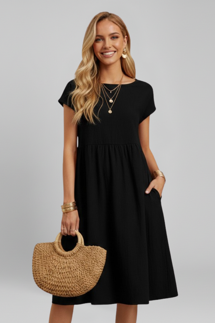 Women's versatile knee-length dress with short sleeves, a round neck, and convenient side pockets.