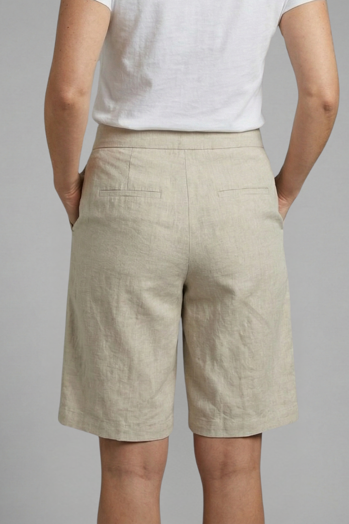 Women's knee-length shorts with secure elastic waistband & functional side pockets, great for active casual wear.
