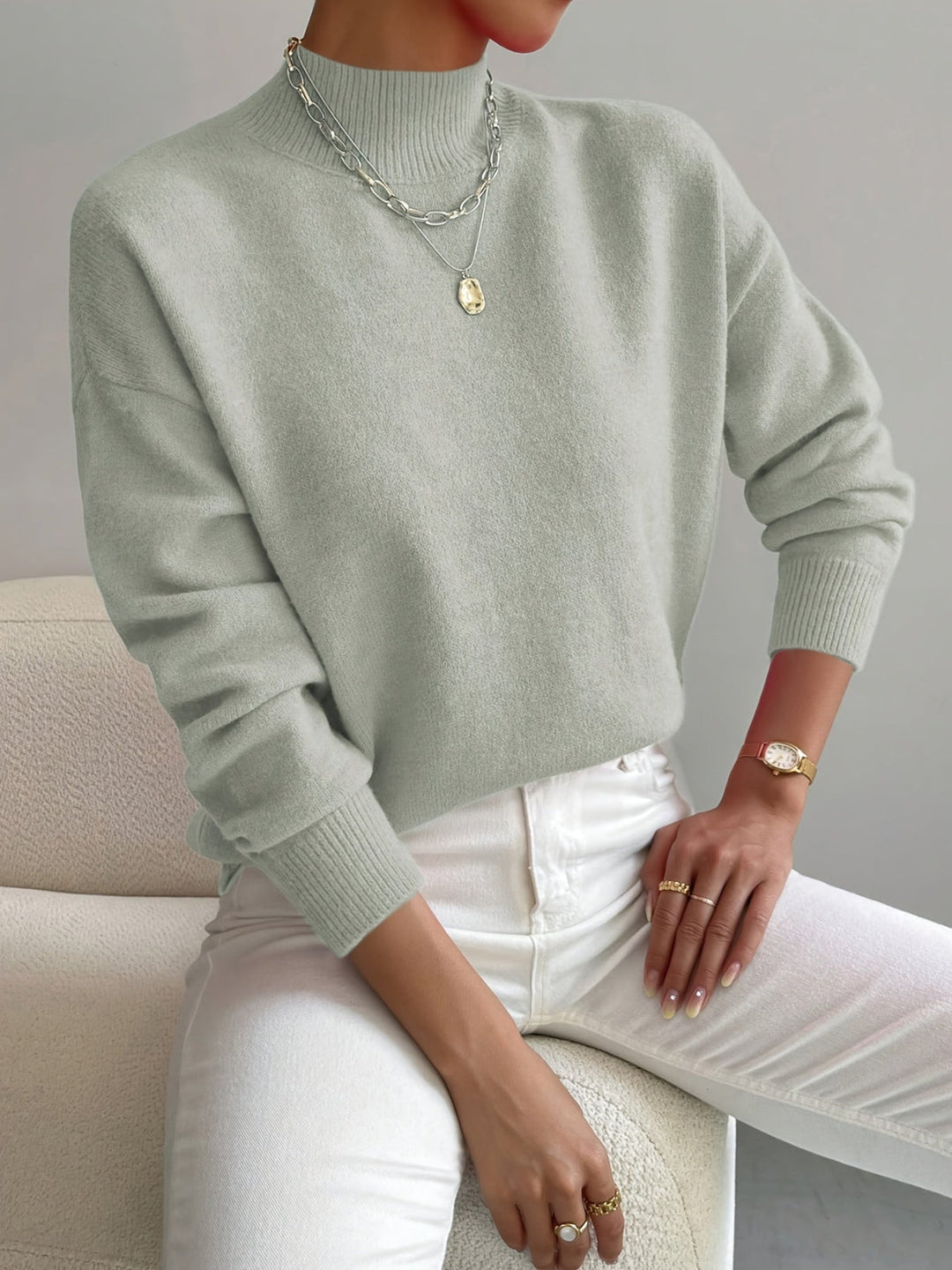 Comfortable women's mock neck knit sweater in a versatile spring color, ideal for casual wear.