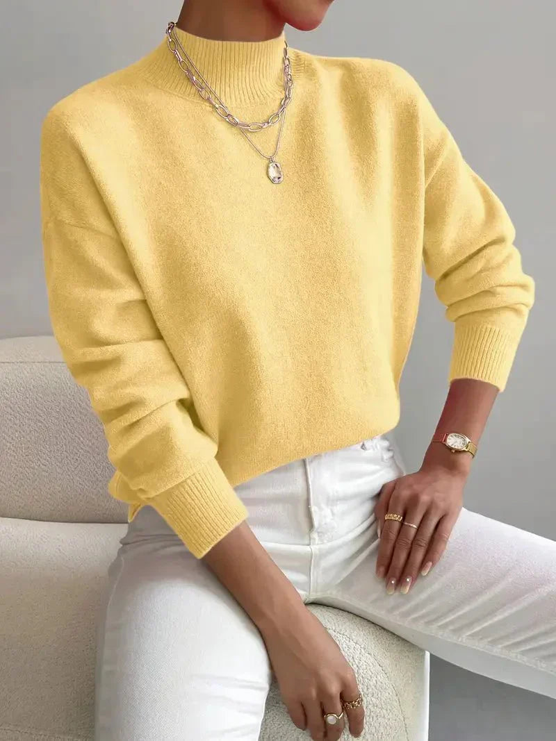 Stylish women's mock neck sweater in a light knit, a comfortable and versatile spring essential.