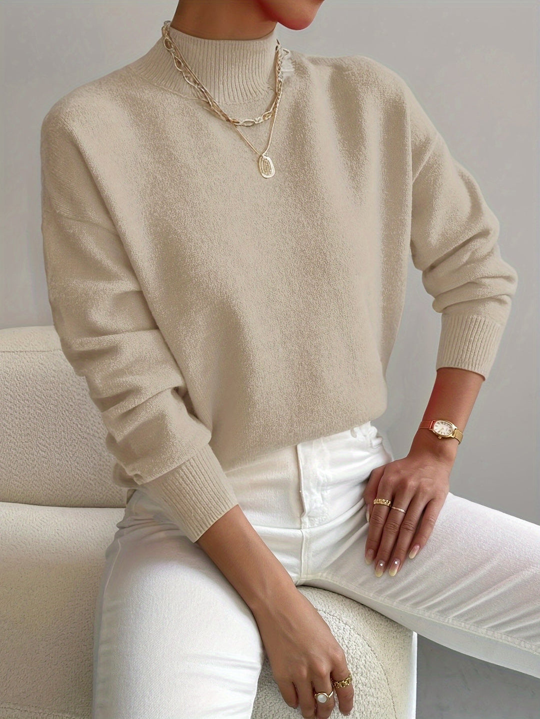 Long sleeve mock neck sweater for women, comfortable and perfect for transitional spring weather.