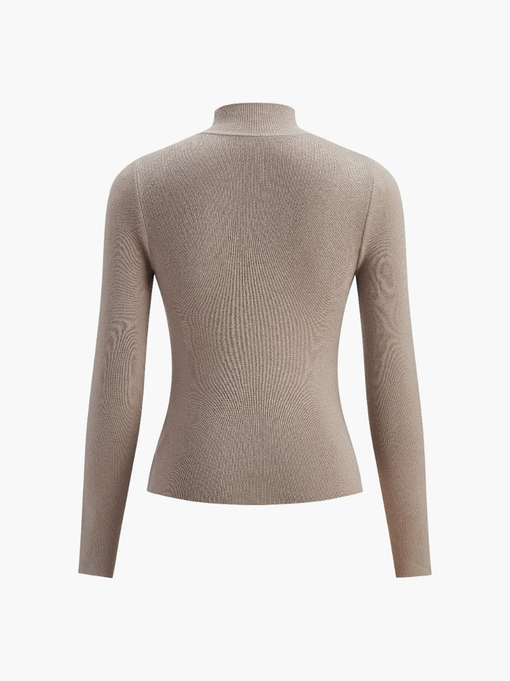 Back view of an elegant women's mock neck long sleeve top, emphasizing its smooth design