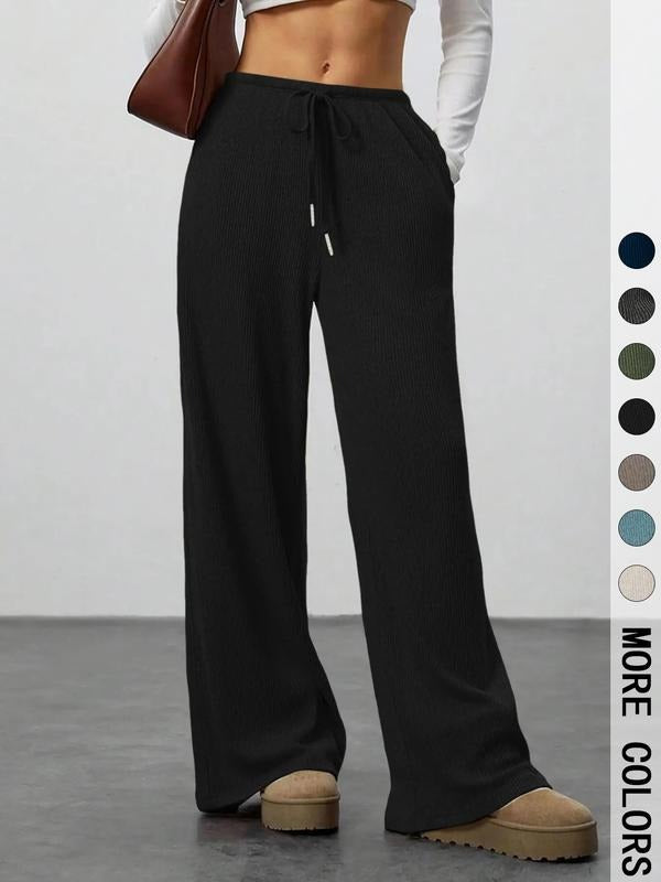 Chic women's wide-leg lounge pants in a soft, ribbed knit fabric, ideal for relaxed or comfy style.
