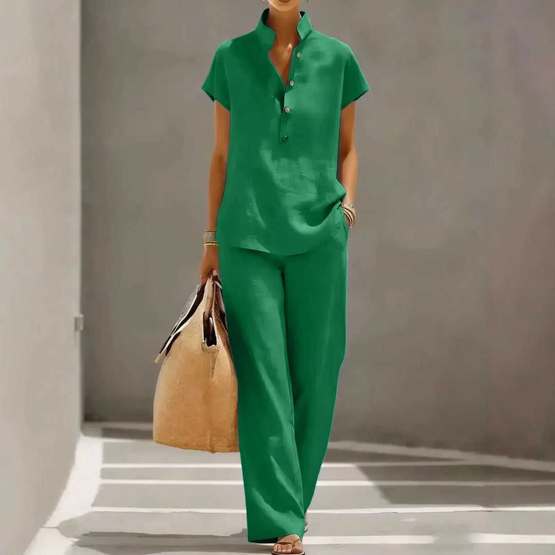 Chic women's short sleeve two-piece resort wear set featuring comfortable wide leg pants for a relaxed look.