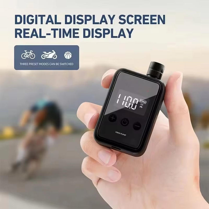 Compact electric mini bike pump with digital display, shown compact and lightweight, ideal for road and mountain biking.