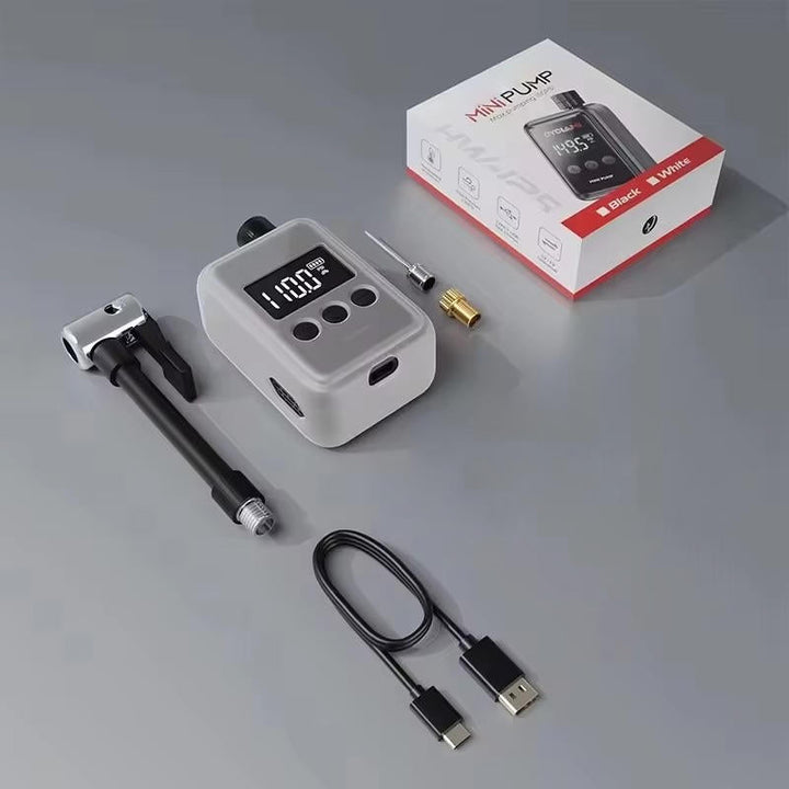 Compact electric mini bike pump with digital display, shown compact and lightweight, ideal for road and mountain biking.