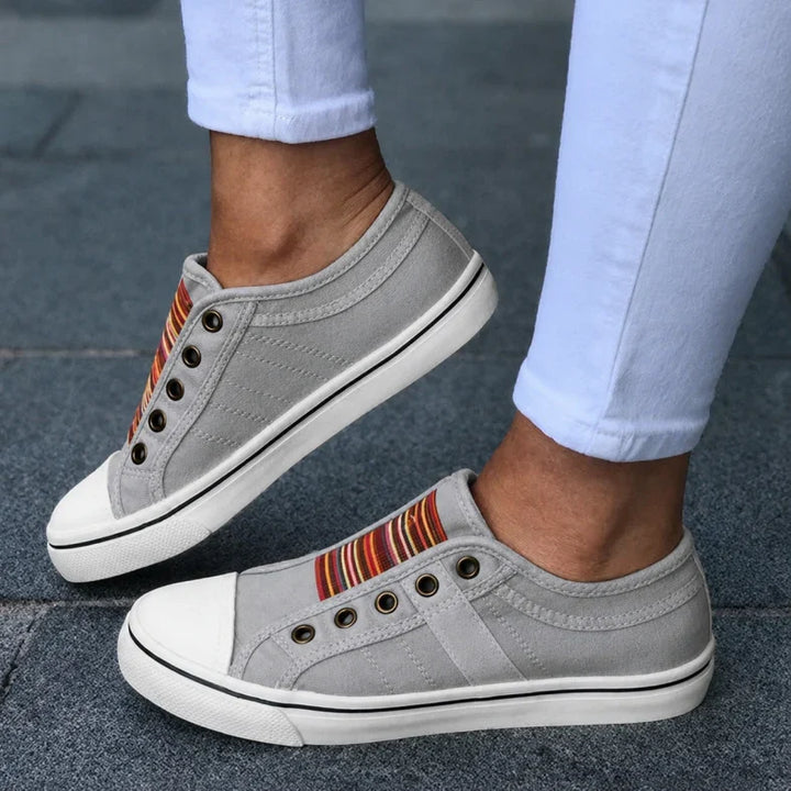 Women's lightweight slip-on summer sneakers in a breathable fabric, perfect for comfortable casual walking.