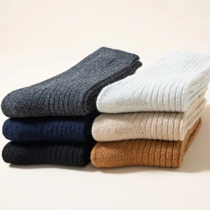 Textured knit wool socks, thick and cozy, designed for unisex winter comfort.
