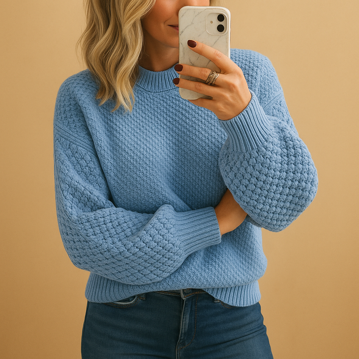 Stylish women's cream pullover sweater featuring a cozy textured knit for cooler weather.
