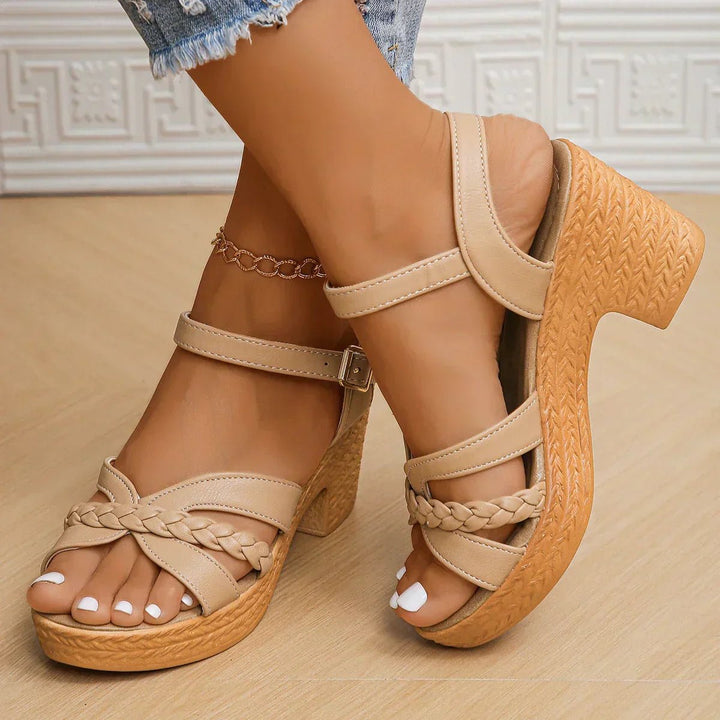 Perfect for summer, these women's casual cross-strap flat sandals boast a comfortable woven sole.