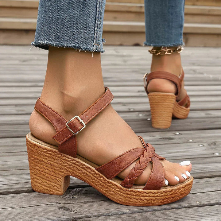 Women's adjustable cross-strap comfort sandals with a trendy woven espadrille sole.