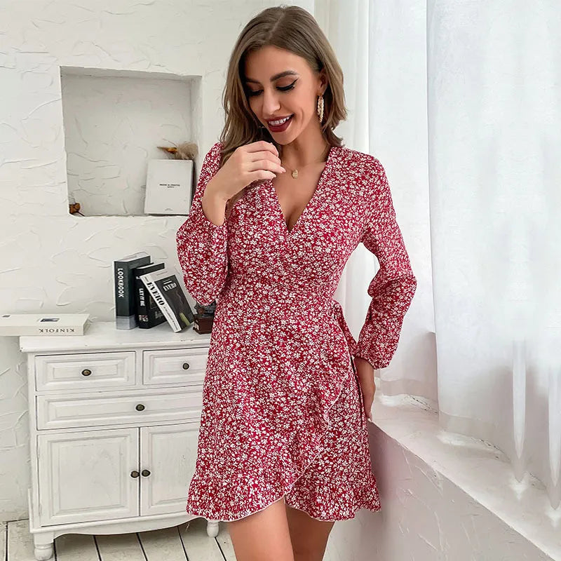 Women's V-neck mini dress in wine red with long sleeves, ruffle wrap design, and flattering tie waist.