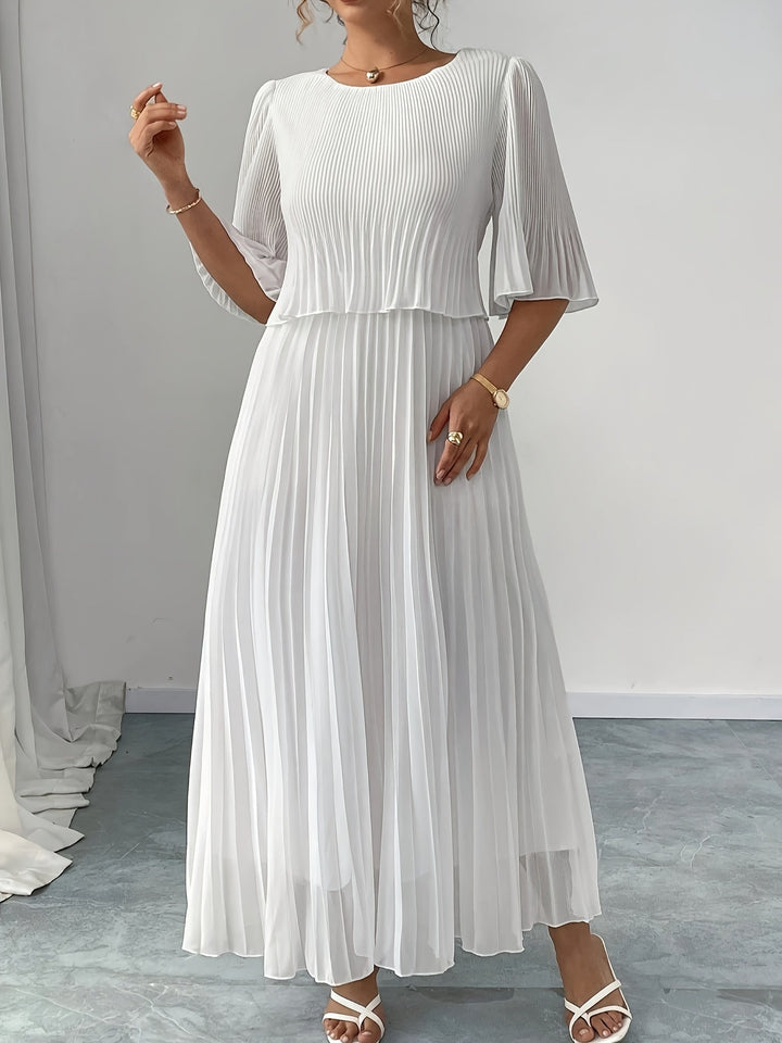Chic women's white pleated A-line maxi dress, an elegant choice for wedding guests, parties & special occasions.