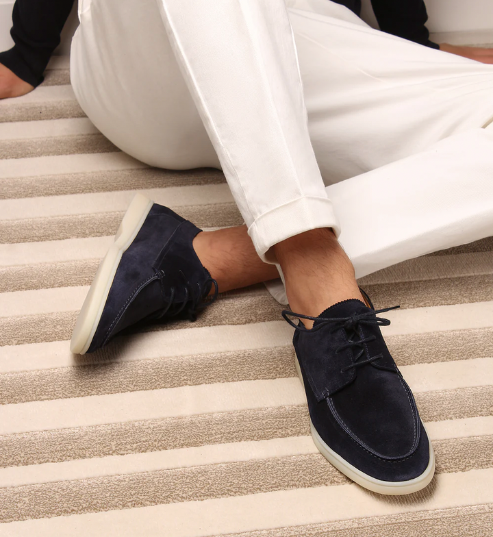 Dark blue men's lace-up loafers with modern moc toe design for smart casual and everyday comfort.