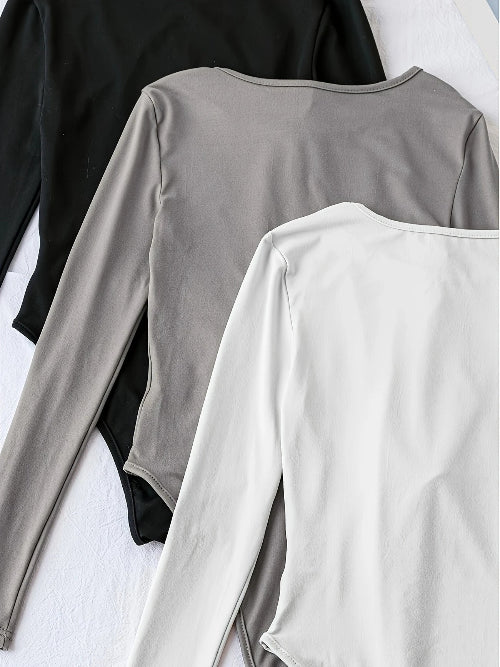 Casual women's 3-pack bodysuits with long sleeves & crew neck. A must-have for versatile outfits.