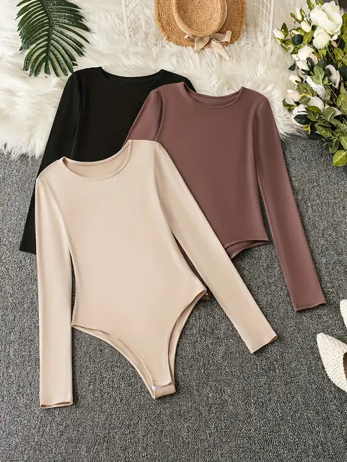Women's 3-pack long sleeve crew neck bodysuits for versatile casual wear. Slim fit wardrobe staple.
