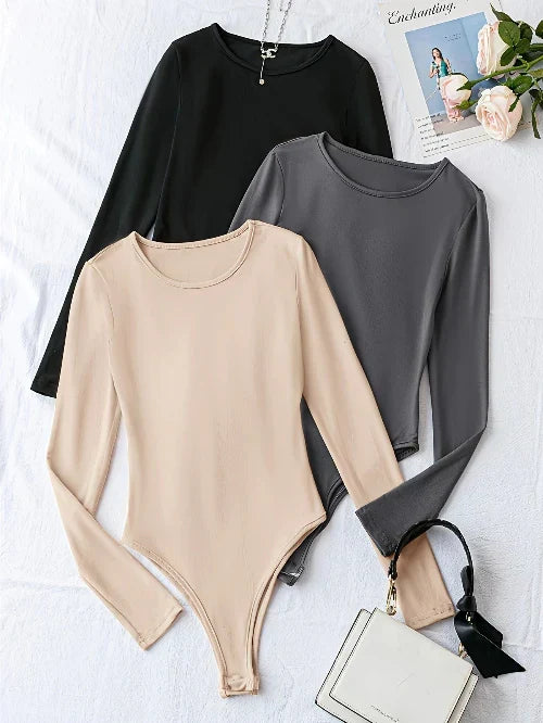 Fashionable women's long sleeve crew neck bodysuits in a 3-pack. Slim fit for a polished look.