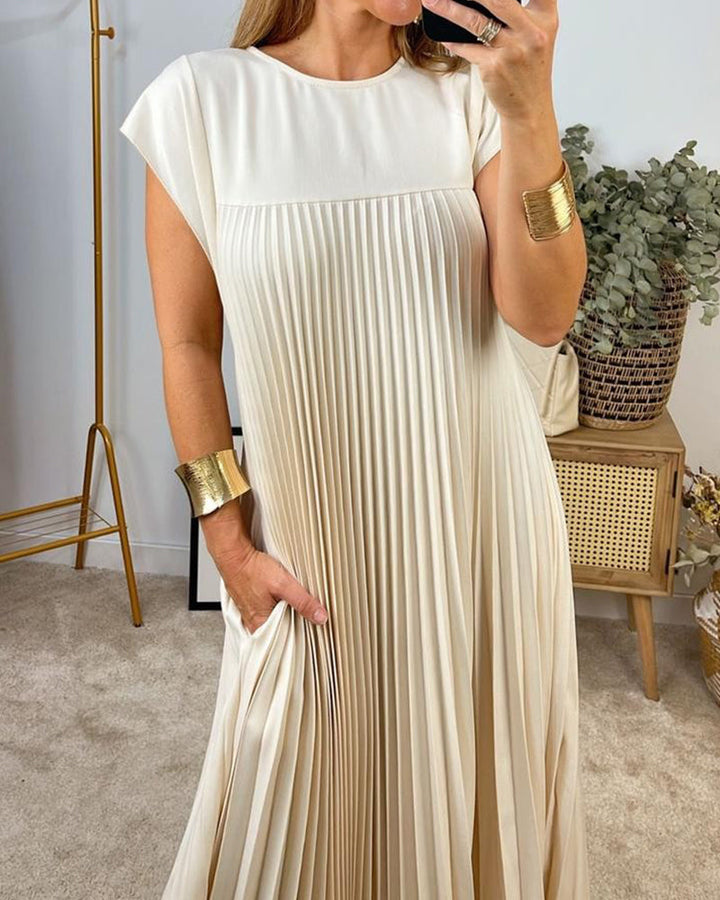 Women's pleated maxi dress with flowing design, perfect for elegant versatile style & comfortable summer wear.