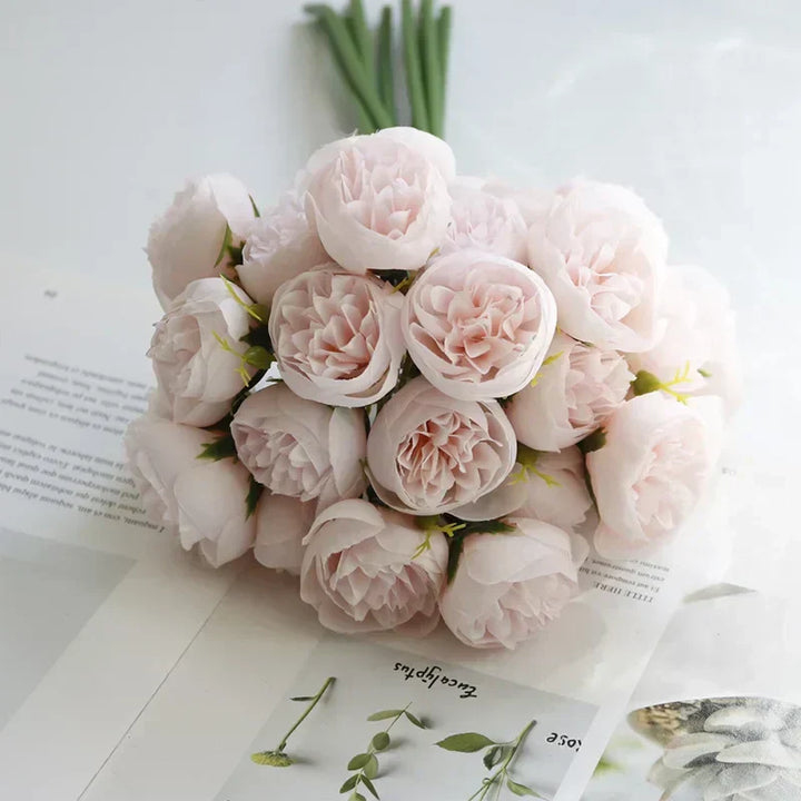 Close-up of a delicate artificial silk peony bouquet, showcasing realistic faux floral details.