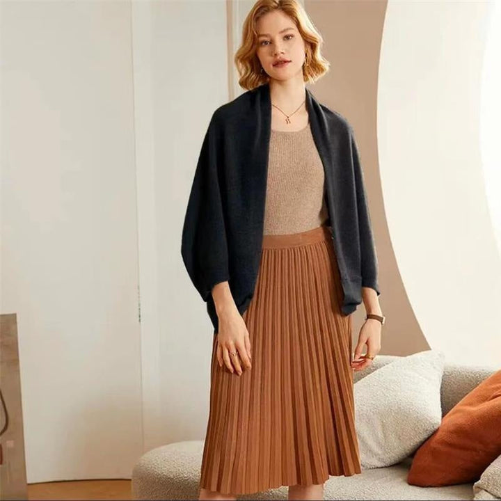 Elegant women's accessory: A soft beige knit shawl wrap, perfect for evening wear.