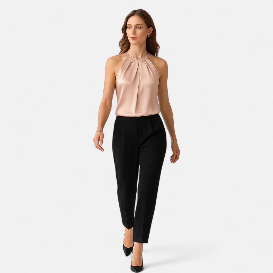 Women's sophisticated sleeveless satin tank in beige, featuring a beautifully draped and pleated design.