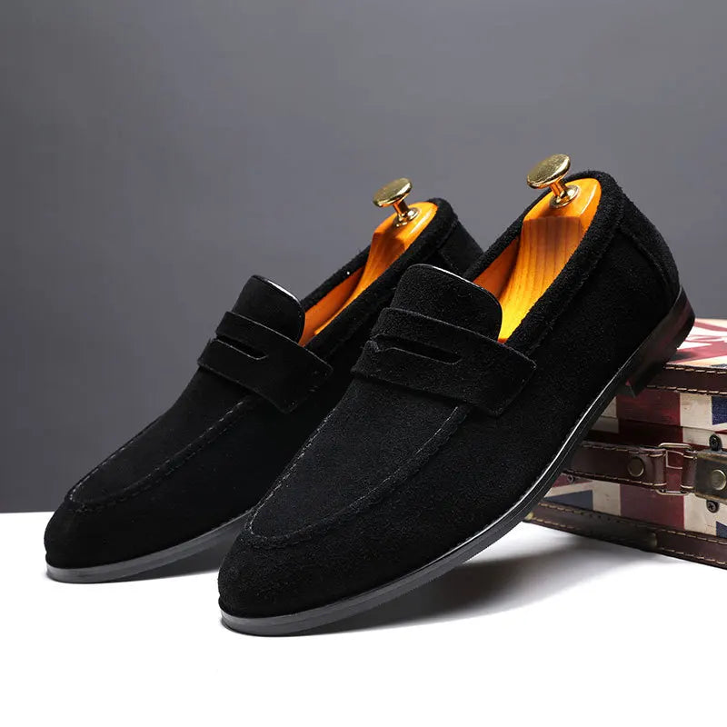 Pair of beige women's loafers, offering comfort and a timeless, sophisticated look