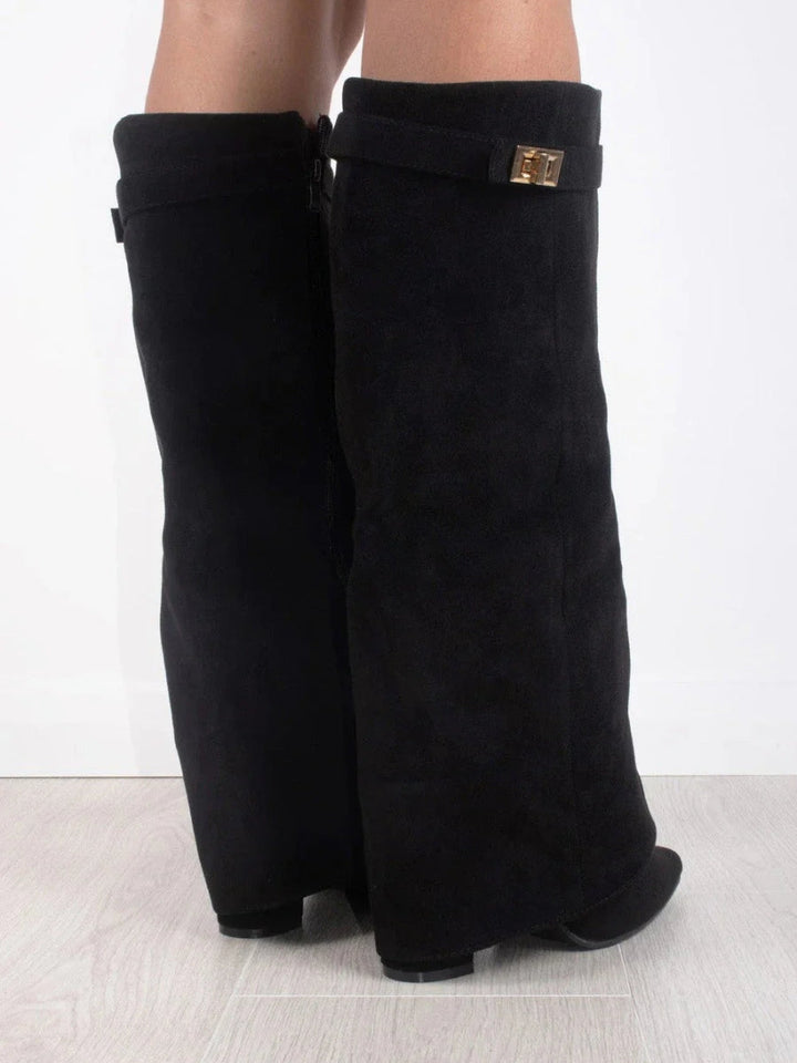 Stylish women's thigh-high boots in premium leather with a striking side buckle accent.
